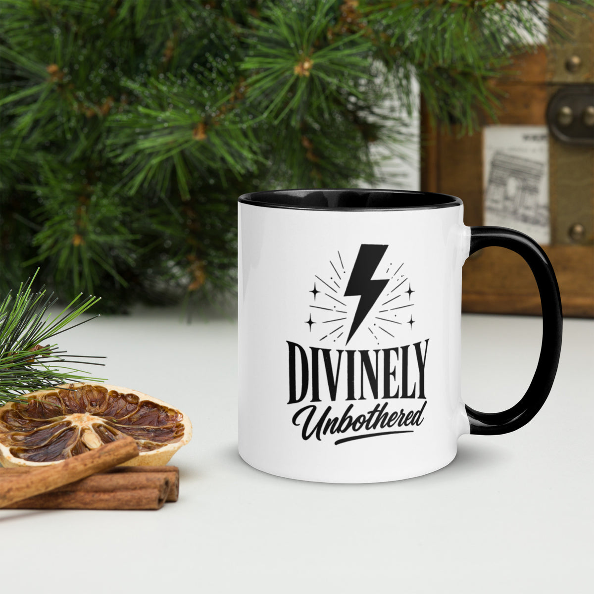 Divinely Unbothered white coffee mug with lightning bolt design, black rim, interior, and handle